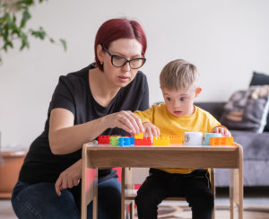 woman helping kid