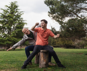 man and boy playing