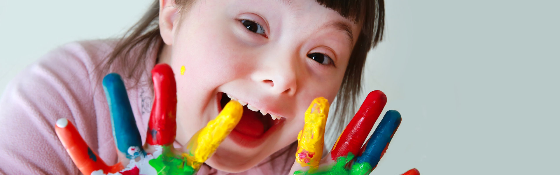 young kid paint in hands